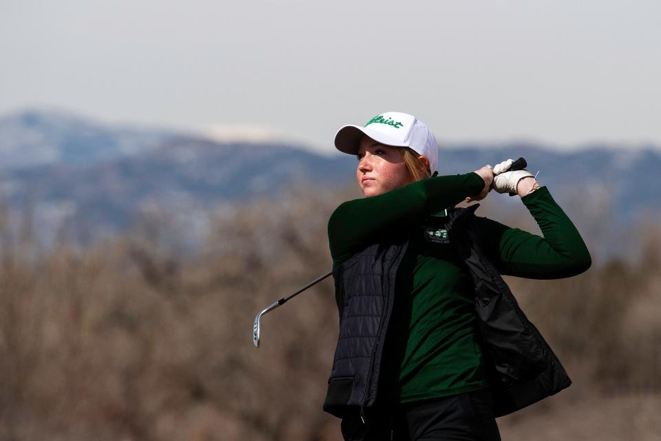 Fossil Ridge's Abbi Beld tees off during the PSD Invite girls golf tournament on Thursday, March 28, 2024 at Harmony Club in Timnath, Colo.