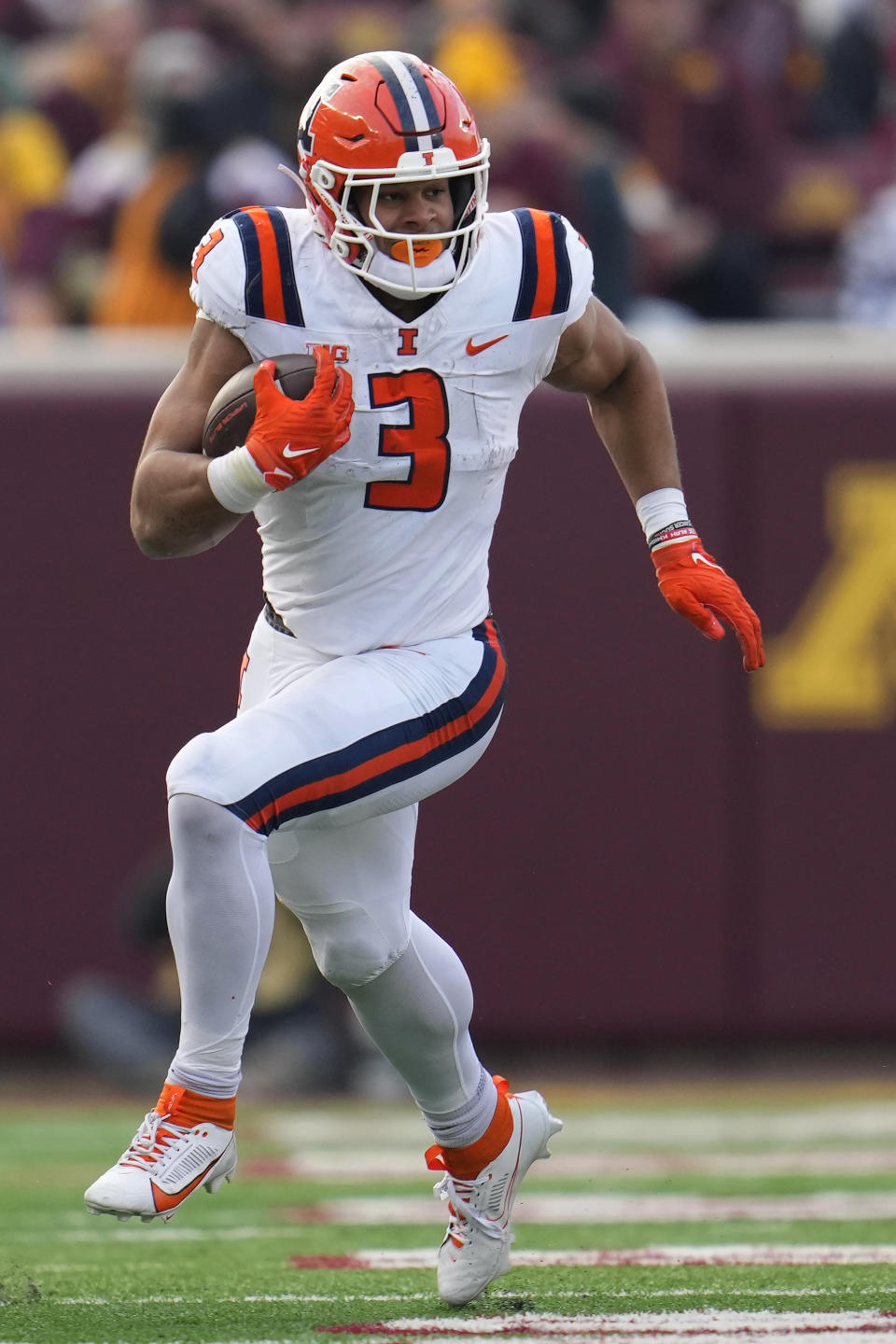 Illinois running back Kaden Feagin (3) runs with the ball during the second half of an NCAA college football game against Minnesota, Saturday, Nov. 4, 2023, in Minneapolis. (AP Photo/Abbie Parr)