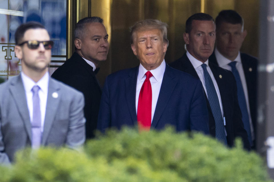 Former President Trump leaves Trump Tower in New York for Manhattan Criminal Court, where he will be booked and arraigned on charges stemming from a hush money payment to a porn actor during his 2016 campaign, Tuesday, April 4, 2023. (AP Photo/Corey Sipkin)