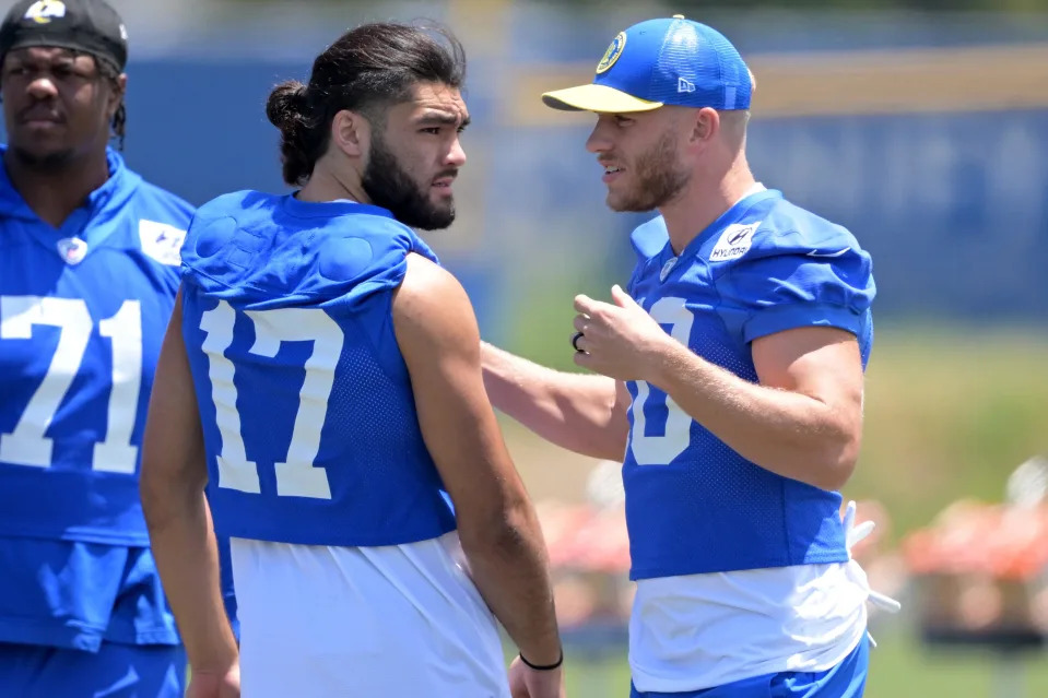 May 28, 2024; Thousand Oaks, CA, USA; Los Angeles Rams wide receiver Puka Nacua (17) and wide receiver Cooper Kupp (10) talk during OTAs at California Lutheran University. Mandatory Credit: Jayne Kamin-Oncea-USA TODAY Sports