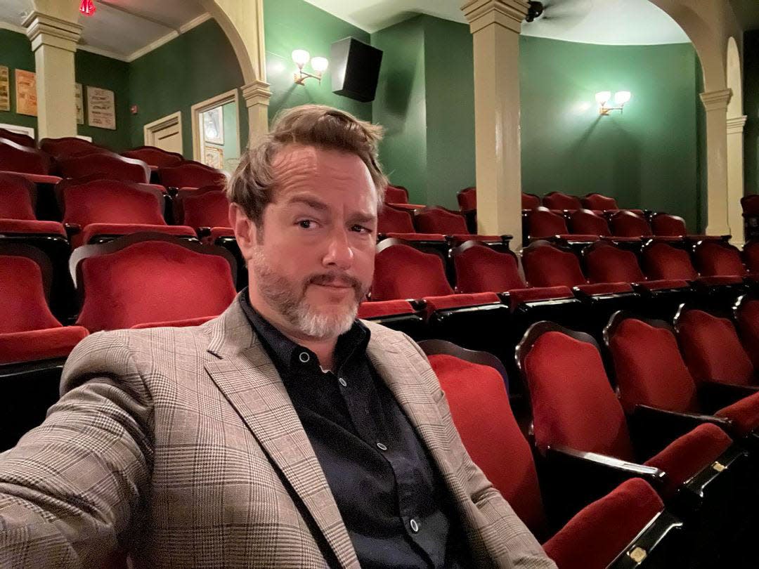 Wilmington comedian Cliff Cash sitting in an empty Thalian Hall, which will be packed to the rafters when he performs there Nov. 9 to tape a comedy special titled "The Long Road."