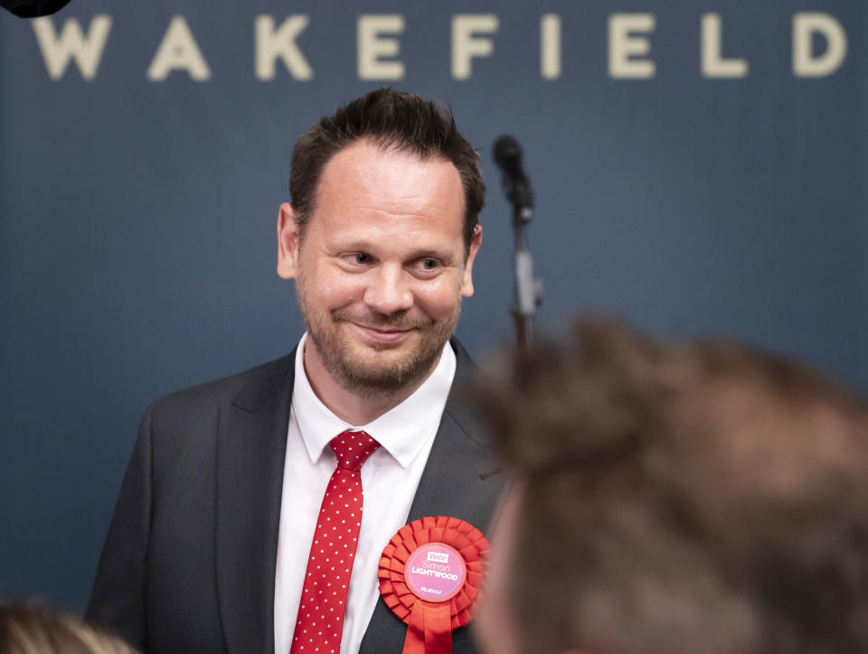 Labour candidate Simon Lightwood celebrates winning the Wakefield by-election, following the by-election count at Thornes Park Stadium in Wakefield, West Yorkshire Friday, June 24, 2022. The by-election was triggered by the resignation of Imran Ahmad Khan following his conviction for sexual assault. (Danny Lawson/PA via AP)