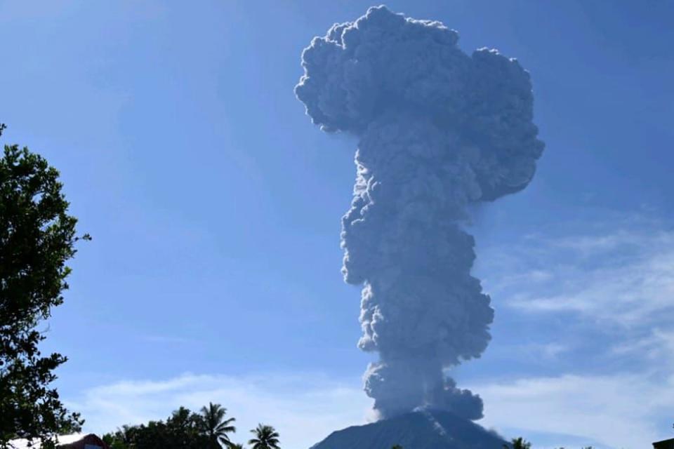 Mount Ibu spews volcanic materials into the air during an eruption in West Halmahera, Indonesia on Monday (AP)