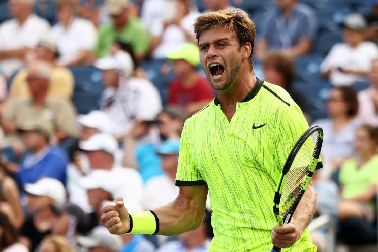 Ryan Harrison had plenty to be happy about, as he pulled off a huge upset over Milos Raonic. (Getty Images)