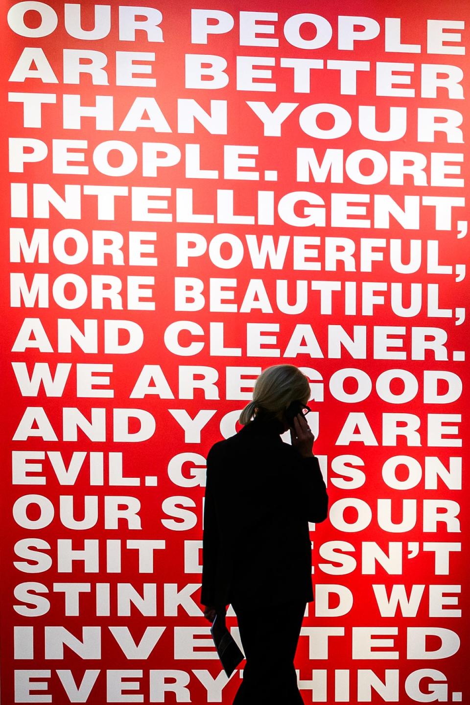 A woman walks past Kruger’s ‘Untitled (Our people are better than your people)’ at the Serpentine (Getty)