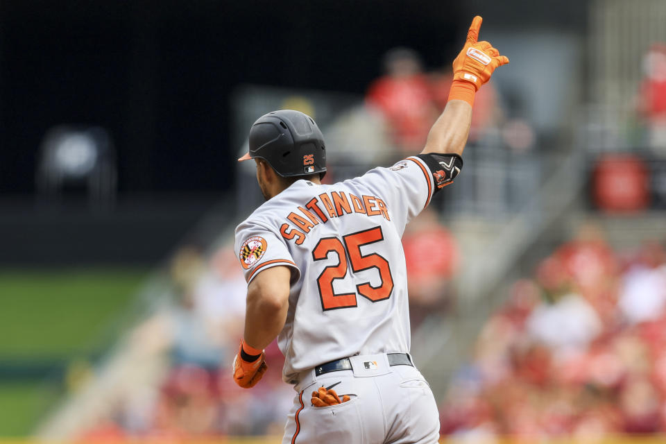 Baltimore Orioles' Anthony Santander points to the stands as he runs the bases after hitting a solo home run during the eighth inning of a baseball game against the Cincinnati Reds in Cincinnati, Sunday, July 31, 2022. (AP Photo/Aaron Doster)