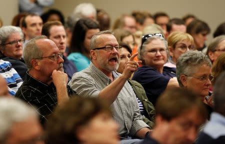 Ed Spears (C) of James Island, SC, makes a point about health care at a town hall meeting for constituents hosted by U.S. Senator Tim Scott (R-SC) in North Charleston, South Carolina, U.S. February 25, 2017. REUTERS/Randall Hill