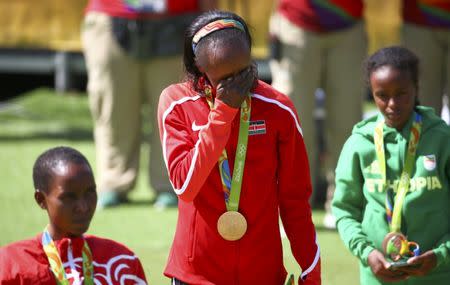 2016 Rio Olympics - Athletics - Victory Ceremony - Women's Marathon Victory Ceremony - Sambodromo - Rio de Janeiro, Brazil - 14/08/2016. Gold medallist Jemima Sumgong (KEN) of Kenya reacts. REUTERS/David Gray