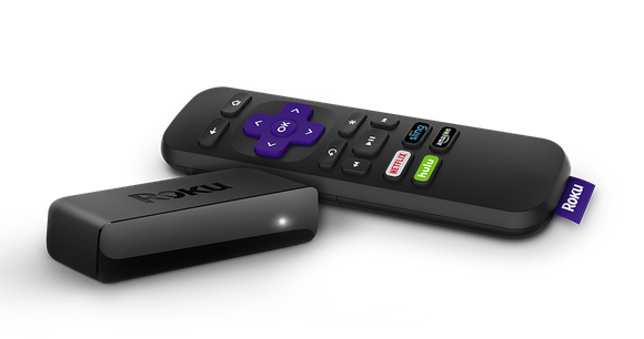 A Roku streaming player sitting next to a remote.