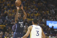 Dallas Mavericks forward Reggie Bullock (25) shoots against Golden State Warriors guard Jordan Poole (3) during the first half of Game 2 of the NBA basketball playoffs Western Conference finals in San Francisco, Friday, May 20, 2022. (AP Photo/Jed Jacobsohn)