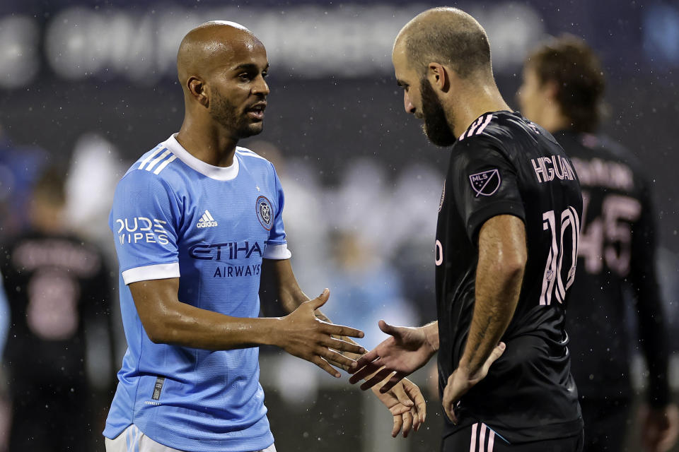 New York City FC forward Héber, left, shake hands with Inter Miami forward Gonzalo Higuaín (10) after an MLS soccer playoff match Monday, Oct. 17, 2022, in New York. (AP Photo/Adam Hunger)