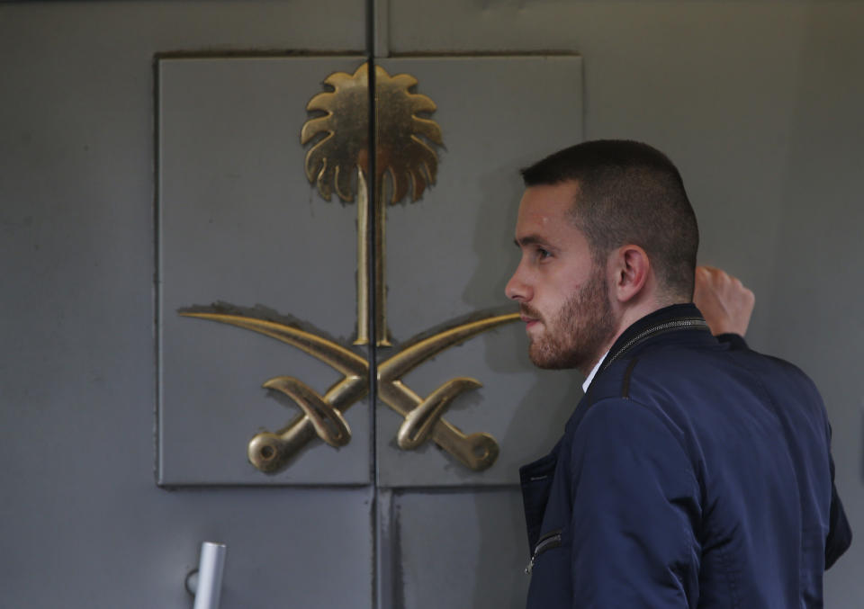 A man waits to enter Saudi Arabia's consulate in Istanbul, Friday, Oct. 19, 2018. A Turkish official said Friday that investigators are looking into the possibility that the remains of missing Saudi journalist Jamal Khashoggi may have been taken to a forest in the outskirts of Istanbul or to another city — if and after he was killed inside the consulate earlier this month. (AP Photo/Lefteris Pitarakis)