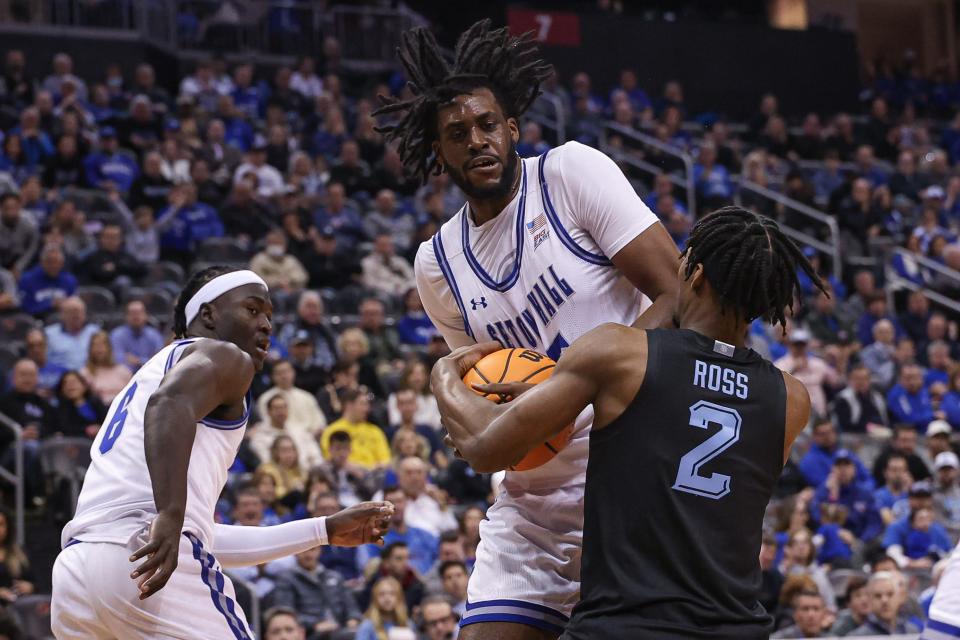 Jan 6, 2024; Newark, New Jersey, USA; Seton Hall Pirates center Jaden Bediako (15) fights for the ball with Marquette Golden Eagles guard Chase Ross (2)