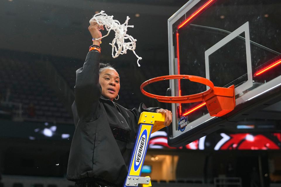 South Carolina coach Dawn Staley cuts down the net after a victory in the Elite Eight. Staley had a chance to be the first woman to ever be a fulltime head coach of a Division I men's basketball team.