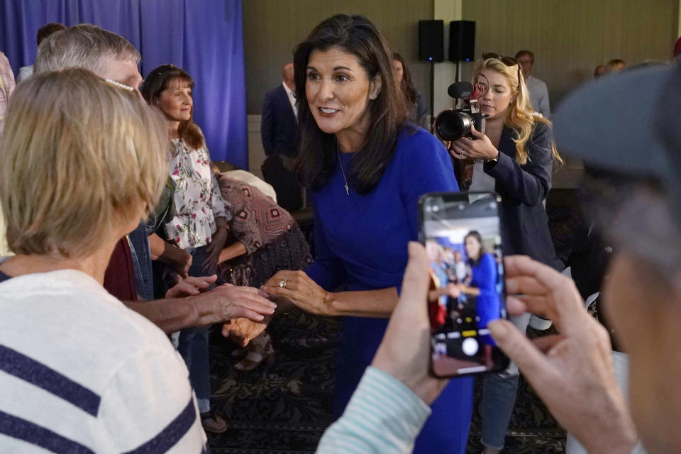 FILE - Republican presidential candidate Nikki Haley greets guests during a campaign gathering, Wednesday, May 24, 2023, in Bedford, N.H. (AP Photo/Charles Krupa, File)