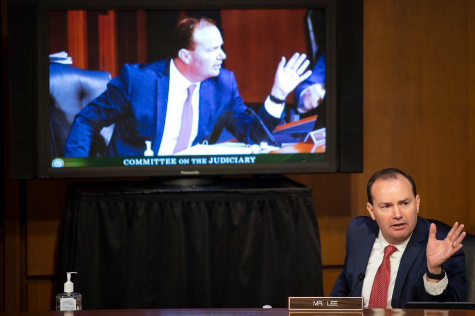 Sen. Mike Lee, R-Utah, who tested positive for COVID-19 earlier this month, speaks during the confirmation hearing of Judge Amy Coney Barrett.