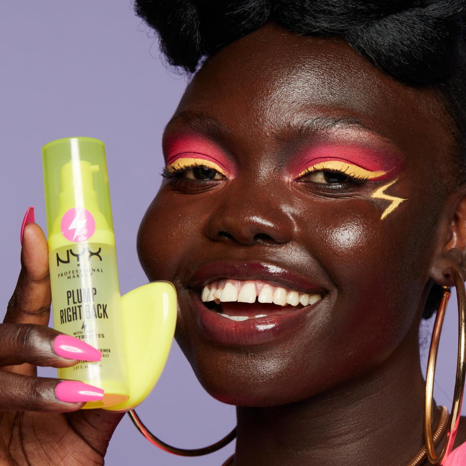 a model holding the makeup primer