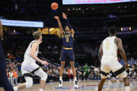 Notre Dame forward Carey Booth (0) shoots during the first half of an NCAA college basketball game against Wake Forest in the second round of the Atlantic Coast Conference tournament, Wednesday, March 13, 2024, in Washington. (AP Photo/Nick Wass)