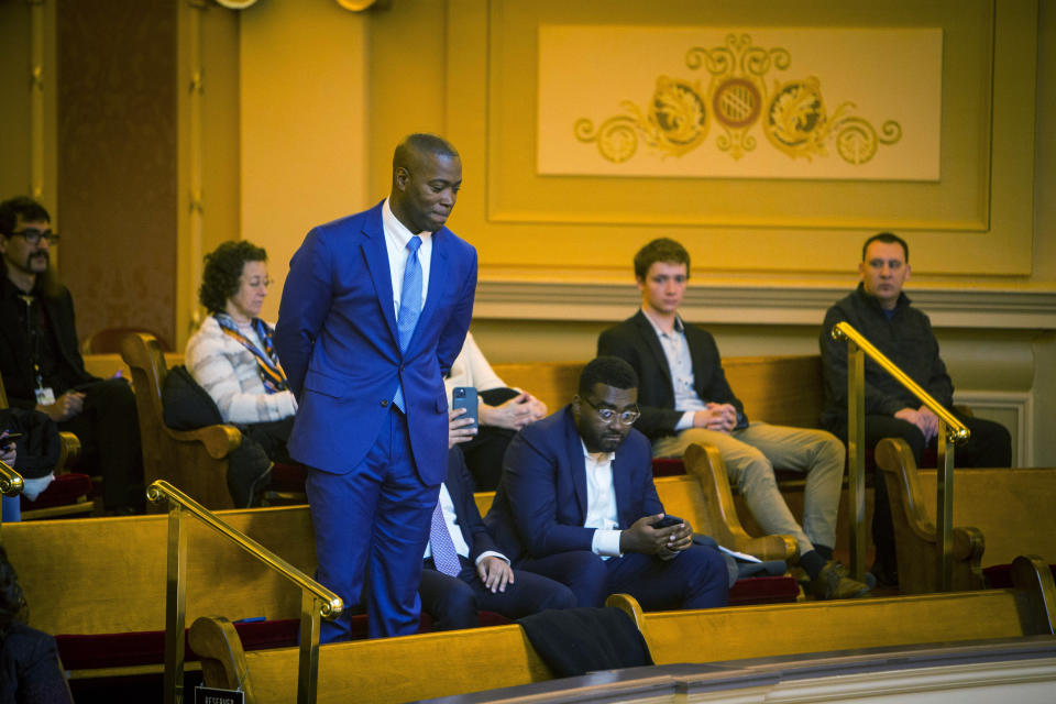 Senator-Elect Aaron Rouse D-Norfolk is recognized by the Virginia senate during the opening day of the Virginia General Assembly in the gallery of the Senate chamber inside the Virginia State Capitol Building in Richmond, Va. on Wednesday, Jan. 11, 2023. Senator-Elect Rouse narrowly defeated Republican Tuesday Kevin Adams for the 7th state Senate district. (AP Photo/John C. Clark)