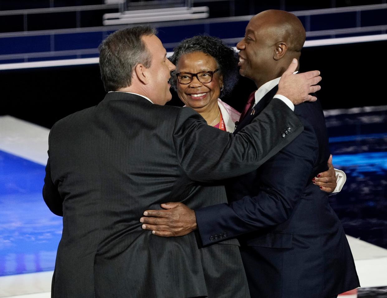 Former New Jersey Gov. Chris Christie with Senator Tim Scott of South Carolina and ScottÕs mother Frances Scott at the conclusion of the Republican National Committee presidential primary debate hosted by NBC News at Adrienne Arsht Center for the Performing Arts of Miami-Dade County.