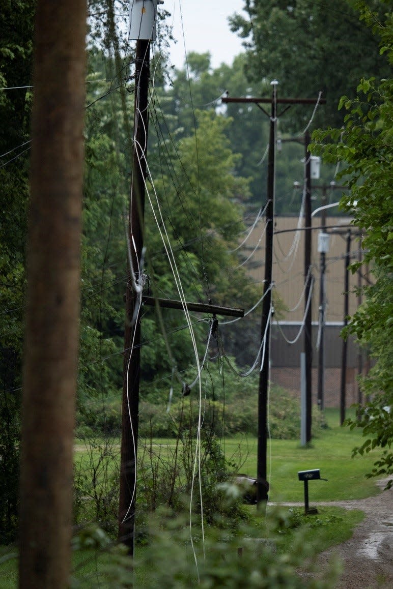 In this provided photo, storm damage is shown to electric poles. Jackson-based Consumers Energy announced Monday, April 29, 2024, it aims to install more than 1,000 iron electric poles in parts of Michigan this year.