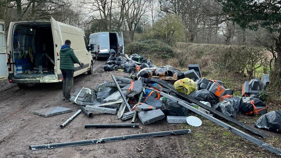 vans and rubbish in a country lane