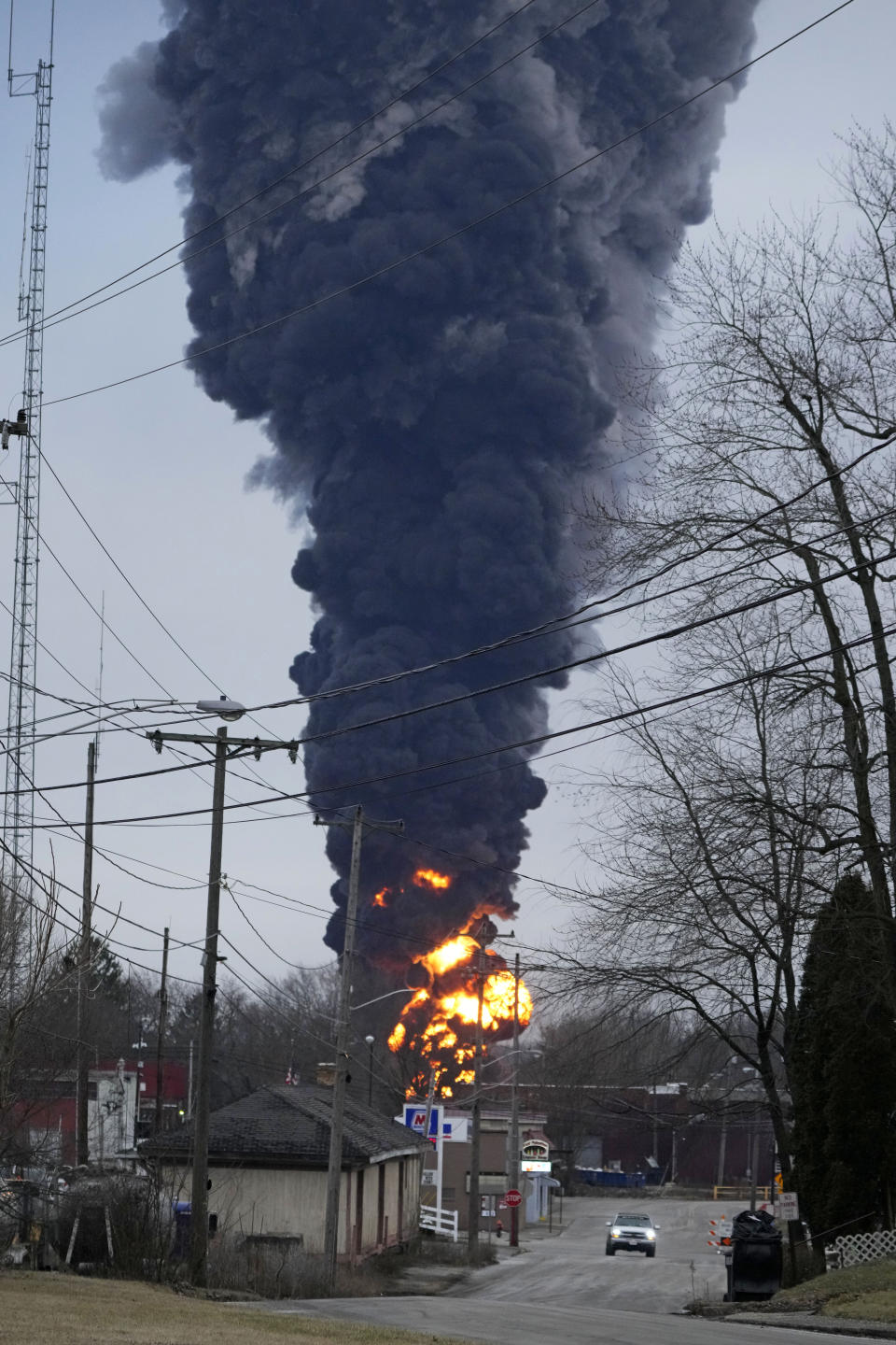 A black plume rises over East Palestine, Ohio, as a result of a controlled detonation of a portion of the derailed Norfolk Southern trains Monday, Feb. 6, 2023. (AP Photo/Gene J. Puskar)