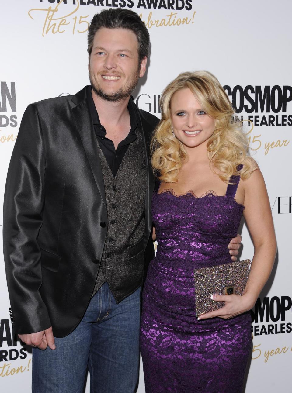 FILE - This March 5, 2012 file photo shows country singers Blake Shelton, left, and his wife, Miranda Lambert at Cosmopolitan Magazine's "Fun Fearless Males and Females of 2012" awards in New York. The couple will attend CMA Music Fest, a four-day opportunity to interact with fans. Lambert performs a set that will include “Over You” and a song with her Pistol Annies trio on Thursday and Shelton is part of Friday's lineup. (AP Photo/Evan Agostini, file)