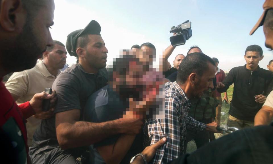 Palestinians escort a captured Israeli civilian