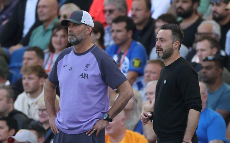 Liverpool manager Jurgen Klopp (left) and Brighton and Hove Albion manager Roberto De Zerbi