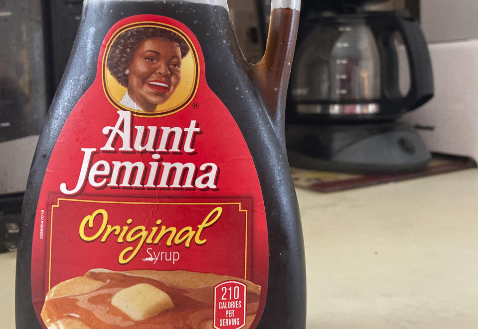 A bottle of Aunt Jemima syrup sits on a counter, Wednesday, June 17, 2020 in White Plains, N.Y. Pepsico is changing the name and marketing image of its Aunt Jemima pancake mix and syrup, according to media reports. A spokeswoman for Pepsico-owned Quaker Oats Company told AdWeek that it recognized Aunt Jemima’s origins are based on a racial stereotype and that the 131-year-old name and image would be replaced on products and advertising by the fourth quarter of 2020. (AP Photo/Donald King)