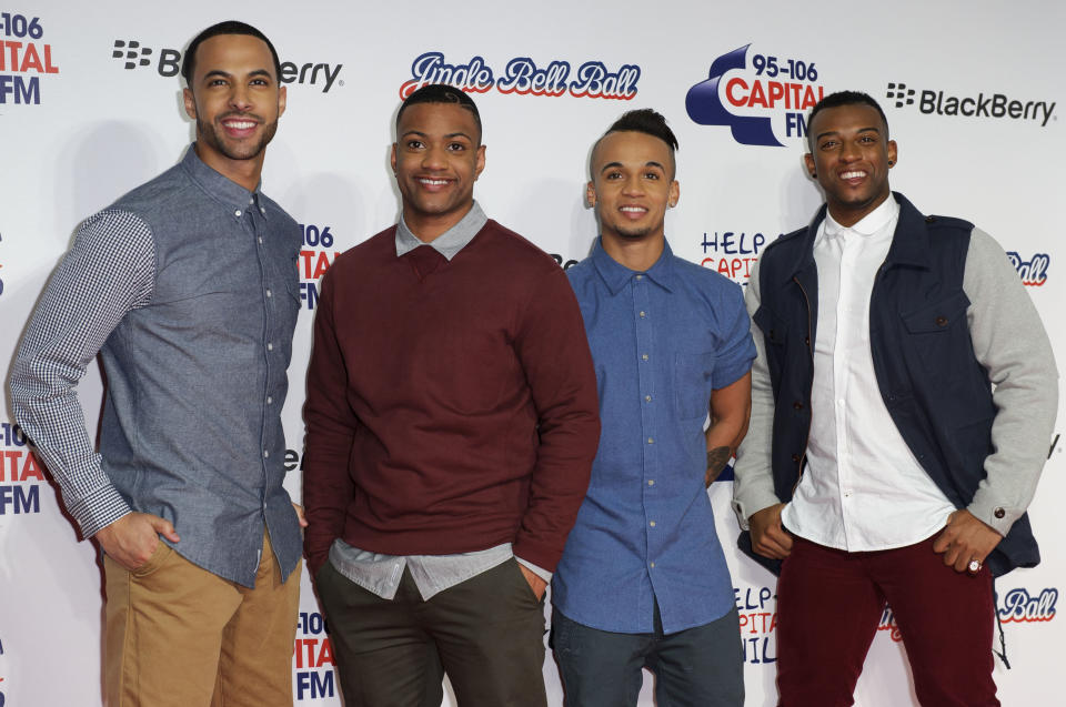 From left, Marvin Humes, JB, Aston Merrygold and Oritse Williams of JLS arrive for the Jingle Bell Ball in London, Saturday, Dec. 8, 2012. (Photo by Jonathan Short/Invision/AP)