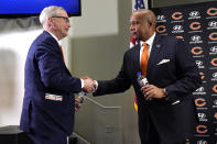 Chicago Bears Chairman George H. McCaskey, left, shakes hands with new President & CEO Kevin Warren during an NFL football news conference at Halas Hall in Lake Forest, Ill., Tuesday, Jan. 17, 2023. (AP Photo/Nam Y. Huh)