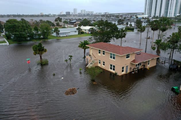 Flood water surrounds a building in Daytona Beach, Florida, on Thursday. Nicole came ashore as a Category 1 hurricane before downgrading. (Photo: Joe Raedle via Getty Images)