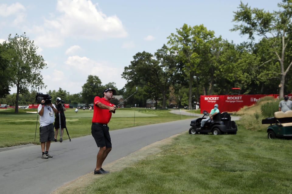 Bubba Watson hits onto the 17th green drives during a nine-hole exhibition ahead of the Rocket Mortgage Classic golf tournament, Wednesday, July 1, 2020, at the Detroit Golf Club in Detroit. (AP Photo/Carlos Osorio)