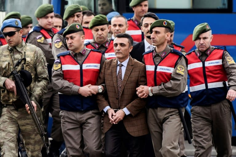 Security forces escorting suspects ahead of a hearing in Mugla where 47 people went on trial over alleged coup links earlier this month