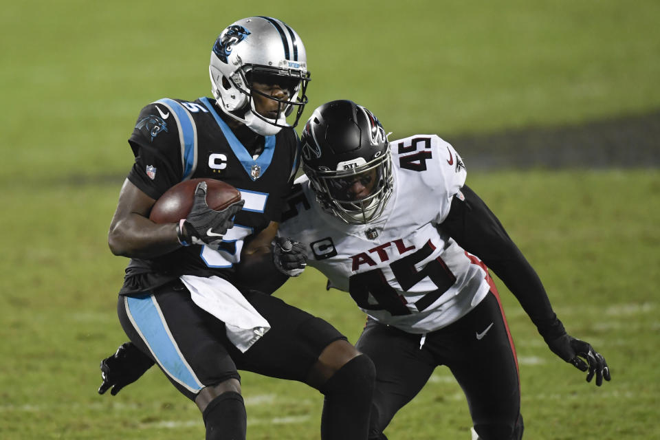 Carolina Panthers quarterback Teddy Bridgewater runs around Atlanta Falcons linebacker Deion Jones during the second half of an NFL football game Thursday, Oct. 29, 2020, in Charlotte, N.C. (AP Photo/Mike McCarn)