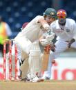 Australian batsman Ed Cowan plays a shot during the fourth day of the second-of-three Test matches between Australia and West Indies April 18, 2012 at Queen's Park Oval in Port of Spain, Trinidad.