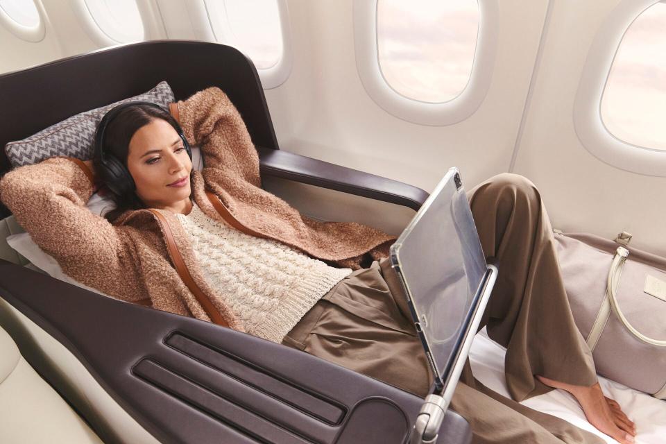 A woman reclines on board the Four Seasons' Airbus A321LR