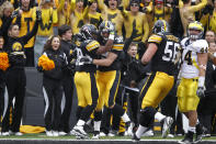 IOWA CITY, IA - NOVEMBER 5: Brad Herman #39 of the Iowa Hawkeyes celebrates with Brad Rogers #38 after catching a one-yard touchdown pass in the first half against the Michigan Wolverines at Kinnick Stadium on November 5, 2011 in Iowa City, Iowa. Iowa won 24-16. (Photo by Joe Robbins/Getty Images)