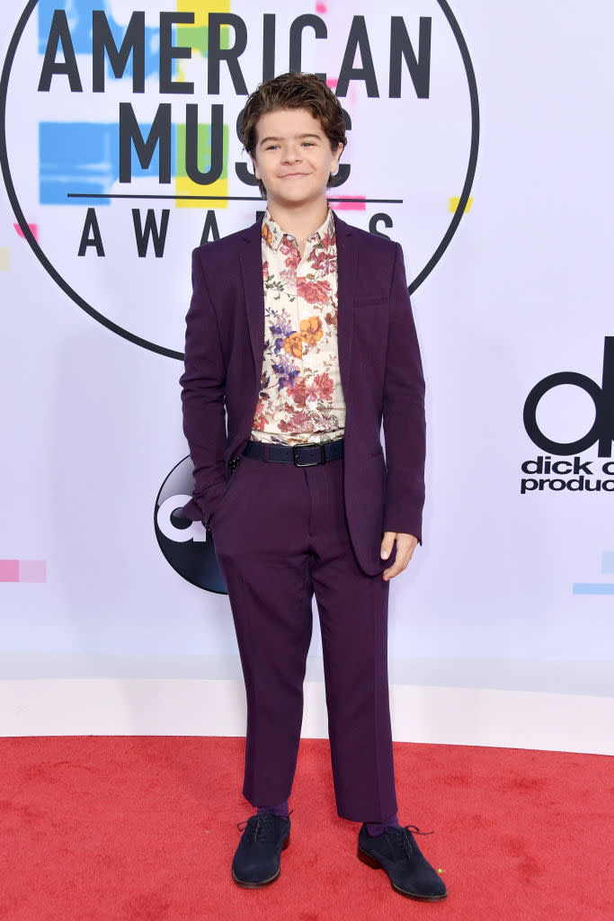 Gaten Matarazzo in a purple suit and floral shirt