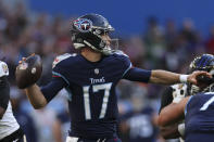 Tennessee Titans quarterback Ryan Tannehill (17) looks to throw a pass against the Baltimore Ravens during the first half of an NFL football game Sunday, Oct. 15, 2023, at the Tottenham Hotspur stadium in London. (AP Photo/Ian Walton)