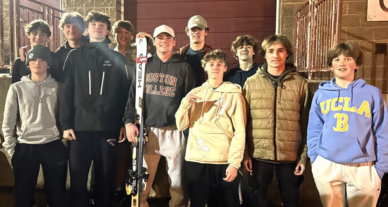 Members of the Portsmouth High School ski team get together after Thursday's 11-team, giant slalom win at Gunstock Ski Resort. The Clippers had three skiers in the top four, and four in the top 10 en route to its second win in as many weeks.