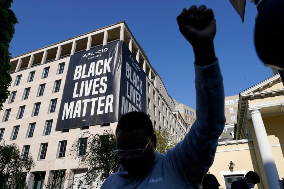 FILE – A person reacts on April 20, 2021, in Washington, at Black Lives Matter Plaza near the White House after the Derek Chauvin verdict in Minneapolis, AP Photo/Alex Brandon, File)