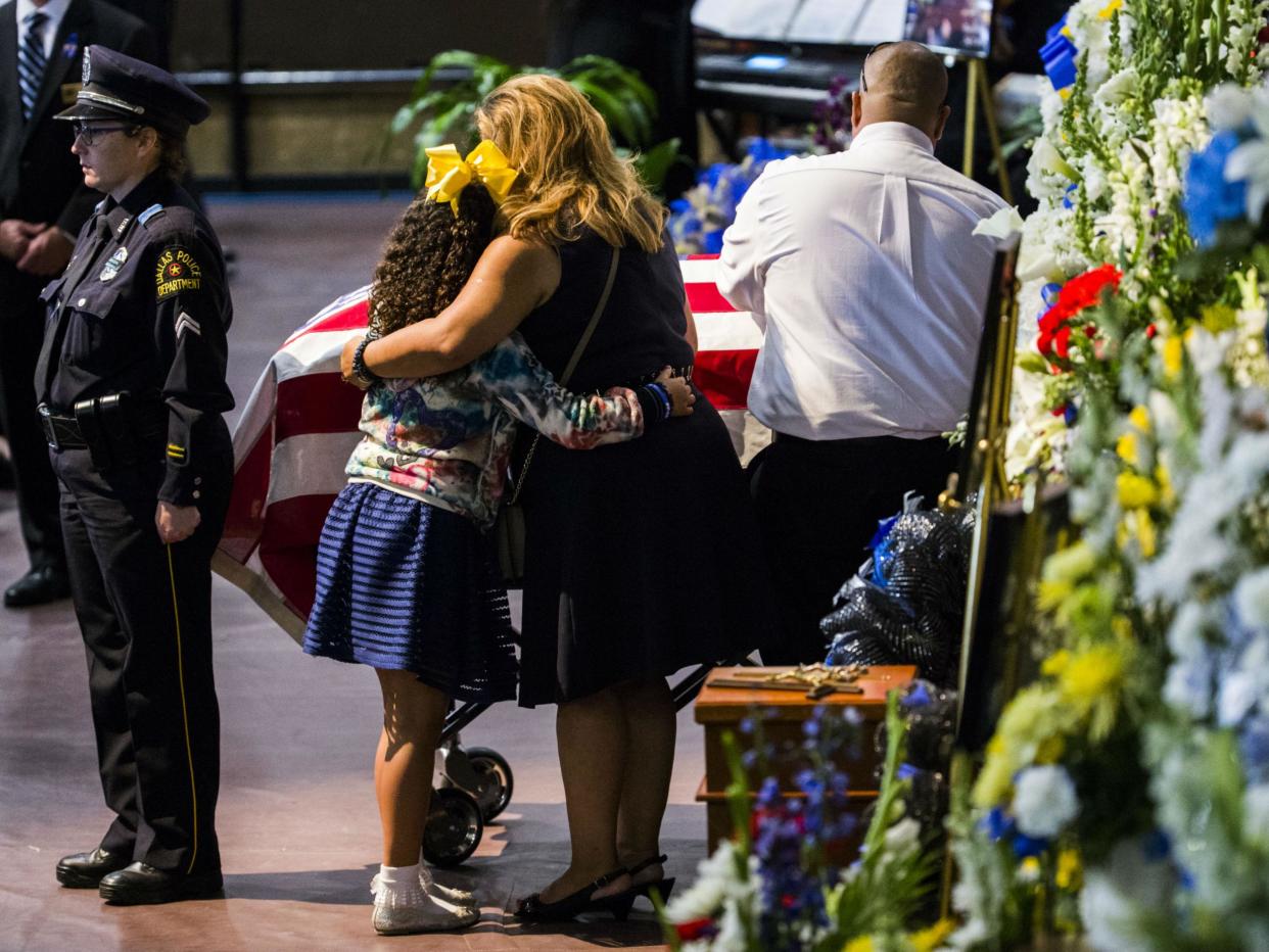 Mourners at a funeral service for a police officer who was among five police officers shot dead the previous week, in Fort Worth, Texas, on July 16, 2016: REUTERS/Ashley Landis/The Dallas Morning News/Pool