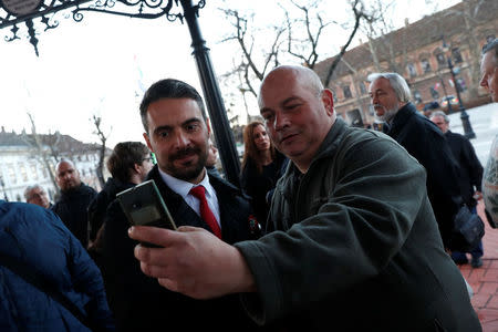 Chairman of the Hungarian right wing opposition party Jobbik Gabor Vona poses for a selfie after a campaign forum in Nagykanizsa, Hungary, March 16, 2018. REUTERS/Bernadett Szabo