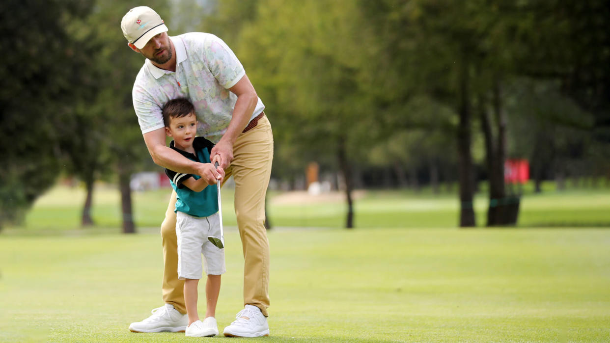CRANS-MONTANA, SWITZERLAND - AUGUST 27: Justin Timberlake shows his son Silas how to put ahead of the Pro-Am prior to the start of the Omega European Masters at at Crans Montana Golf Club on August 27, 2019 in Crans-Montana, Switzerland.