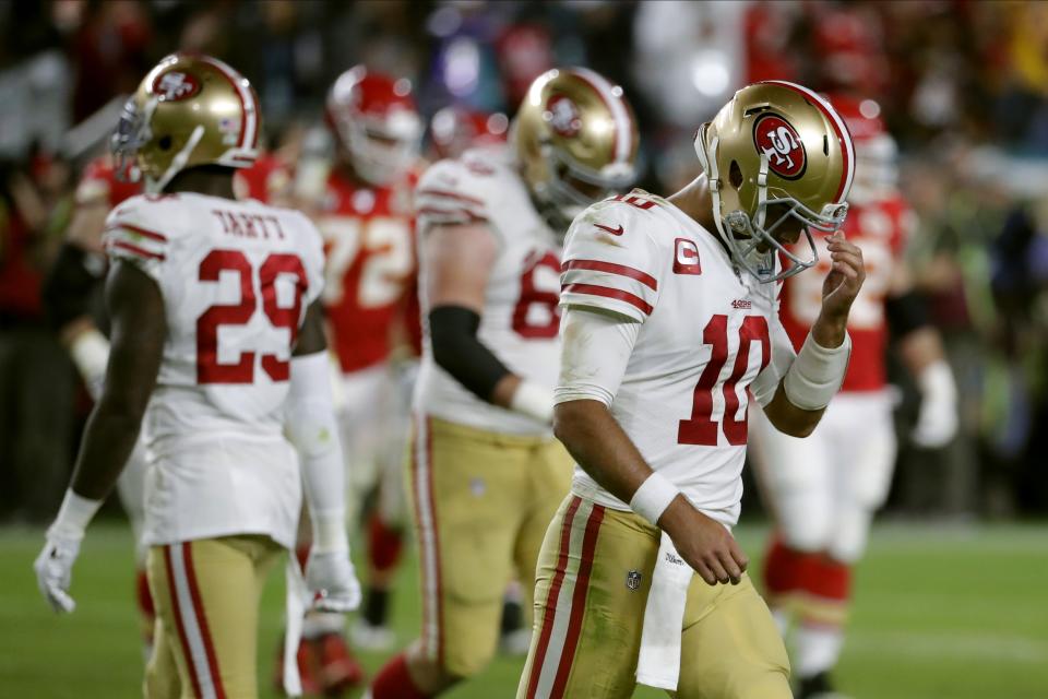 San Francisco 49ers quarterback Jimmy Garoppolo walks to the sideline during the second half of the NFL Super Bowl 54 football game against the Kansas City Chiefs Sunday, Feb. 2, 2020, in Miami Gardens, Fla. (AP Photo/Matt York)