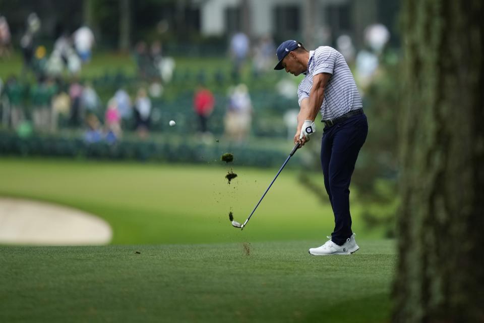 Bryson DeChambeau hits from the fairway on the first hole during the first round at the Masters golf tournament at Augusta National Golf Club Thursday, April 11, 2024, in Augusta, Ga. (AP Photo/Matt Slocum)