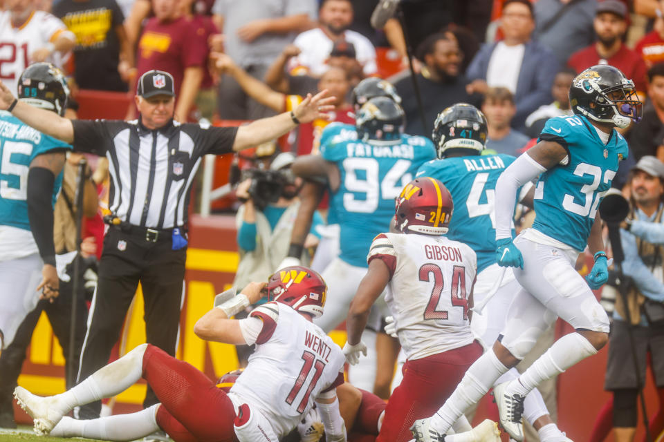 Washington Commanders quarterback Carson Wentz (11) reacts after throwing another interception during the second half of a NFL football game between the Washington Commanders and the Jacksonville Jaguars on Sunday, Sept. 11, 2022 at FedExField in Landover, Md. (Shaban Athuman/Richmond Times-Dispatch via AP)